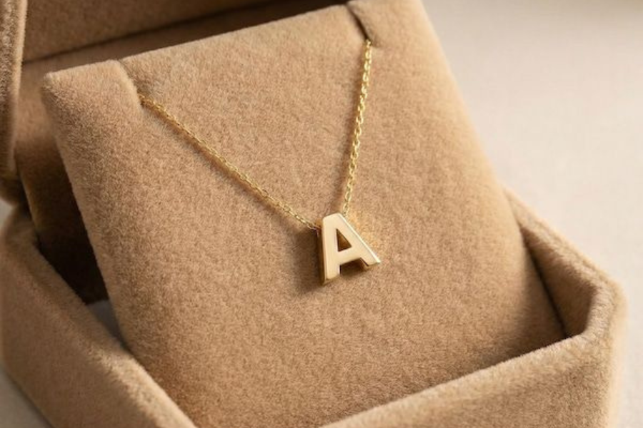 kalung huruf dan simbol